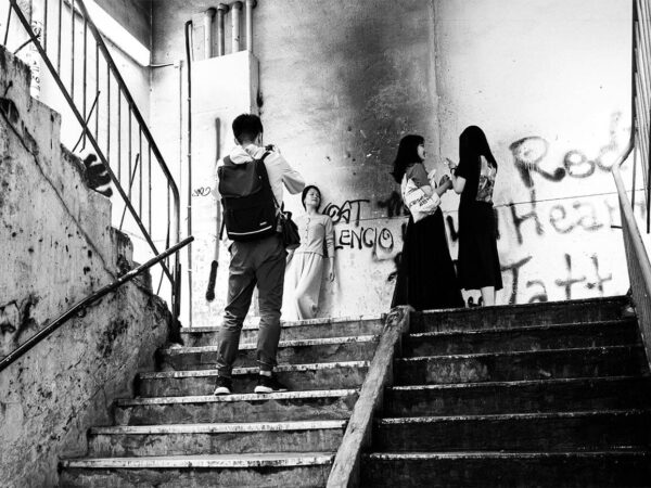 Photo #38 Hong Kong, 2019: woman gets a photo on stairs